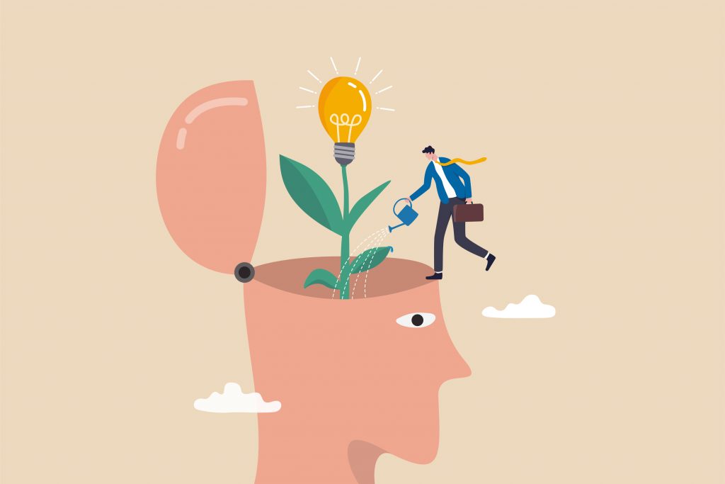 Depiction of growth using an illustration of a man watering a lightbulb on a stem, which is coming out of the head of another man